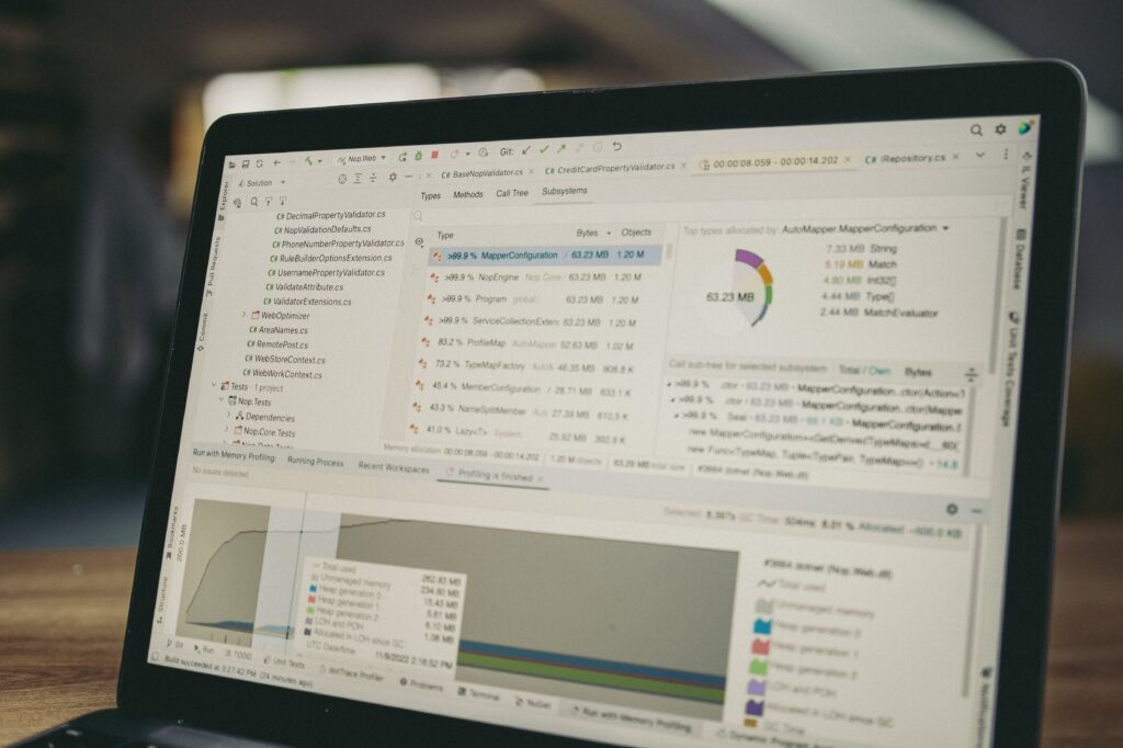 Laptop screen showing a data-analysis and coding interface on a desk, representing Meta ads AI decision-making